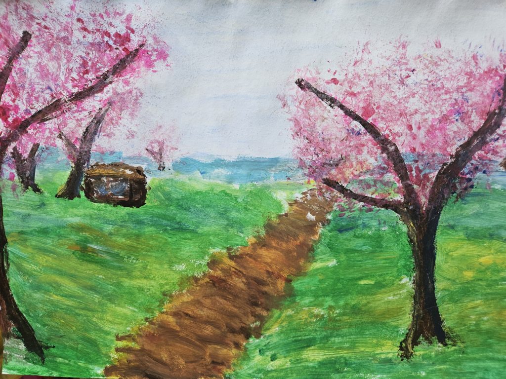 Na pracy droga biegnąca po horyzont. Po bokach drzewka kwitnące na różowo i po lewej stronie brązowy domek