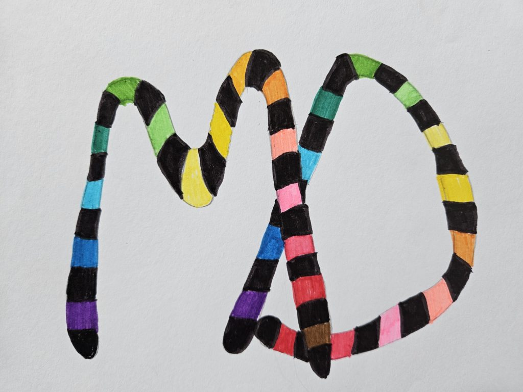 Na pracy dwie złączone z sobą literki: M i D