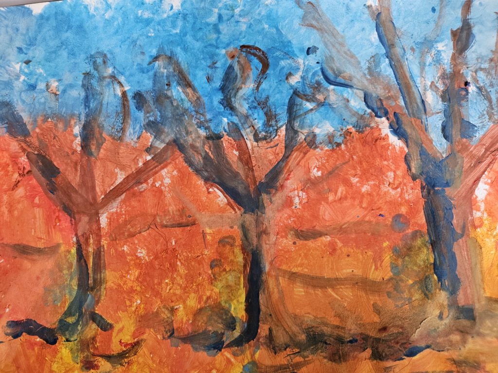 Praca przedstawia krajobraz jesienny z trzema drzewami na pierwszym planie