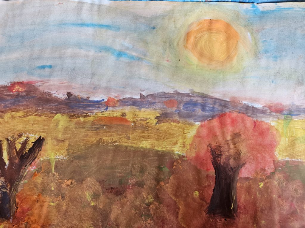 Praca przedstawia krajobraz jesienny z polanami , górkami aż po horyzont, na których stoją pojedyncze drzewa. Całość w gamie barw jesiennych