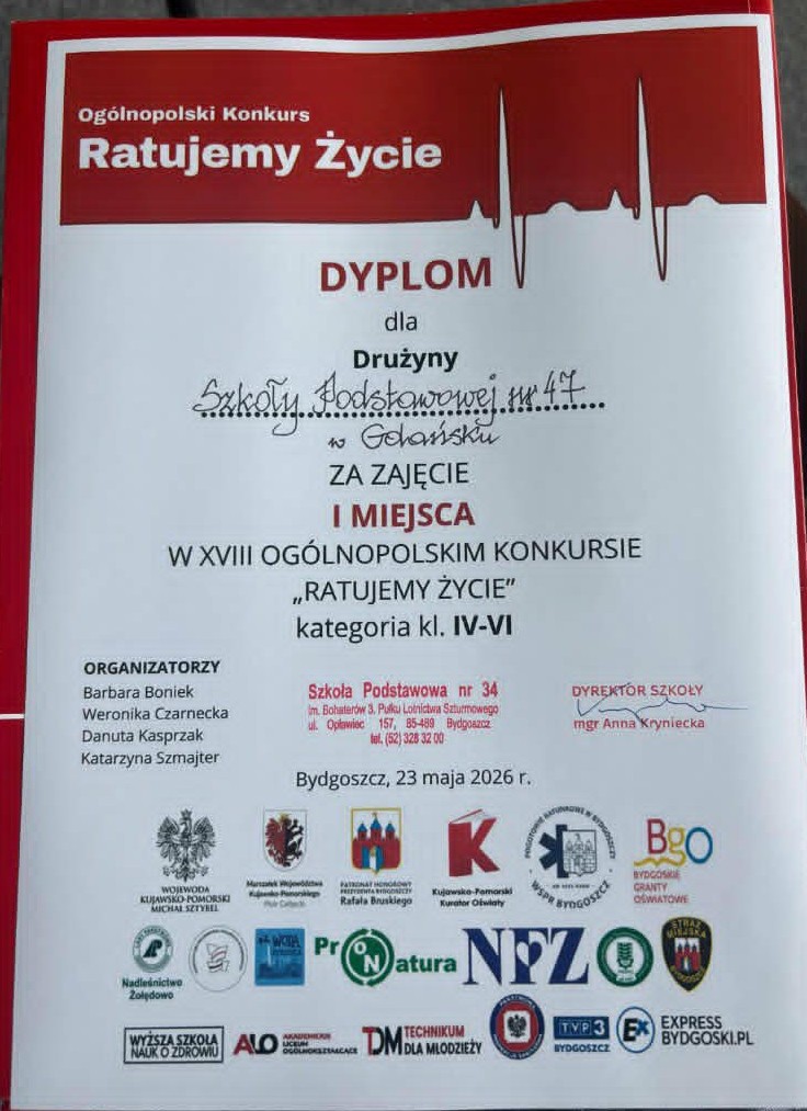 Dyplom dla drużyny Szkoły Podstawowej nr 47 w Gdańsku za zajęcie I miejsca w XVIII Ogólnopolskim Konkursie „Ratujemy Życie”. W tle ikonki sponsorów konkursu.